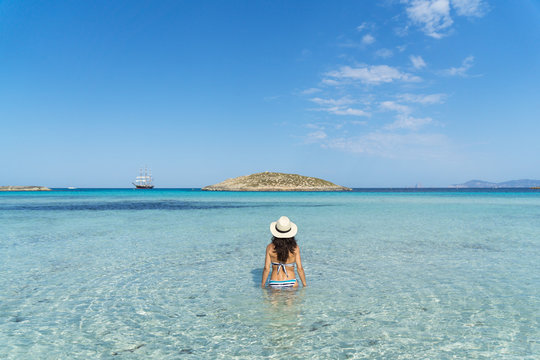 Young woman in a paradise beach