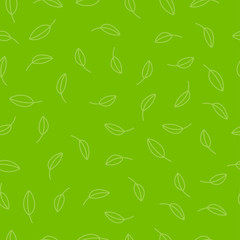 Seamless organic pattern. Leaves on a green background.