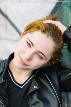 Smiling young caucasian girl with red hair