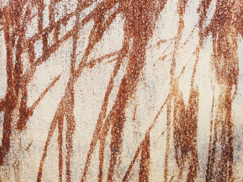 Detail of dripping patterns on rusty metal wall