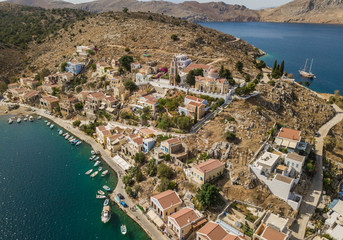 Fototapeta premium Aerial view of small town with colorful houses on Symi island