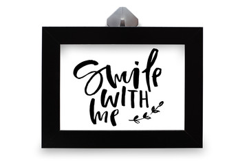 Smile with me. Handwritten text. Modern calligraphy. Inspirational quote. Black photo frame