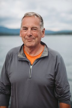 Portrait Of Older Man Smiling Near Water