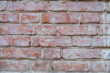 Old wall of red briks tiled background, regular block texture. Wallpaper of ordinary building. Background