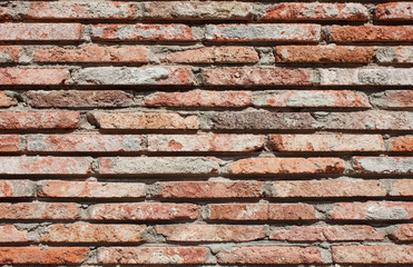 Old wall of red briks tiled background, regular block texture. Wallpaper of ordinary building....