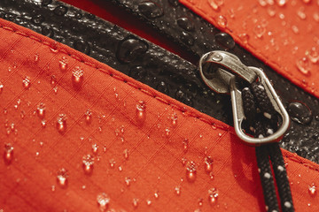 Waterproof zip and fabric of a hardshell mountaineering jacket.