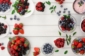 Naklejka na ściany i meble Healthy breakfast with berries and yogurt on white wooden table