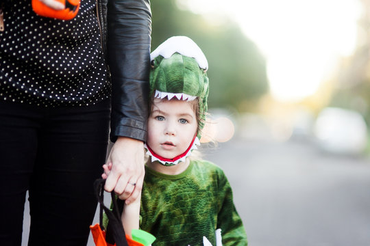 Young boy and his mother trick or treating