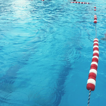 Striped Swimming Pool Ropes On A Summer Day