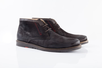 Male brown leather boot on white background, isolated product, comfortable footwear.