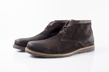 Male brown leather boot on white background, isolated product, comfortable footwear.
