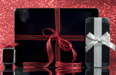 Smartphone and smartwatch and tablet pc and decorations for Christmas