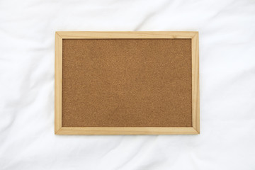 Fototapeta premium Wooden frame for photo on the fabric background