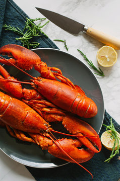 Cooked lobsters on plate on table