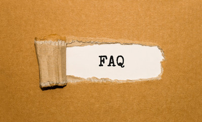 The text FAQ Frequently Ask Question,appearing behind torn brown paper