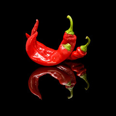 Three red hot chili peppers