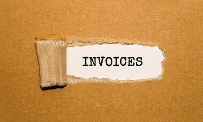 The text INVOICES appearing behind torn brown paper