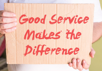 Good Service Makes the Difference on cardboard in hands man 