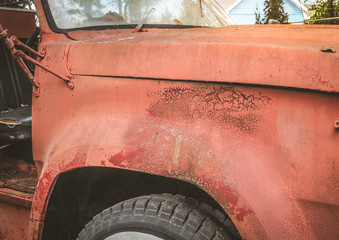 Surface crack of red color on body car, Vintage car image