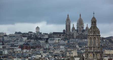 Skyline View of Monmartre, Paris in France with dark Clouds