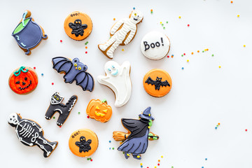 Bright halloween gingerbread cookies pattern on white background top view copyspace