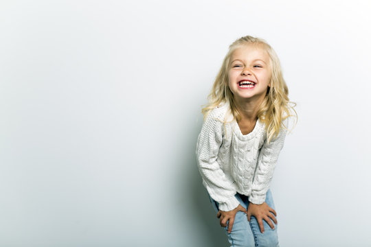 Cute girl 4-5 year old posing in studio