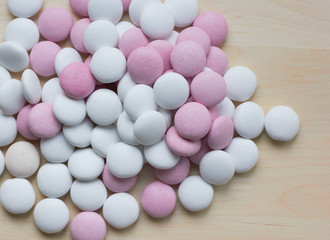  colored round candy scattered on the table