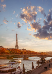 Fototapeta na wymiar Paris with Eiffel Tower against colorful sunset in France