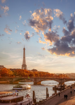 Paris with Eiffel Tower against colorful sunset in France