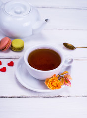 black tea in a white round cup with a saucer