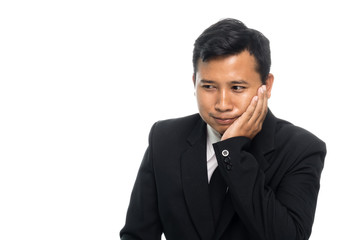 Portrait of a business man having a toothache. Isolated on white background