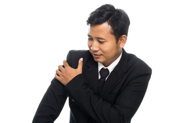 Portrait of a business man having an arm pain. Isolated on white background