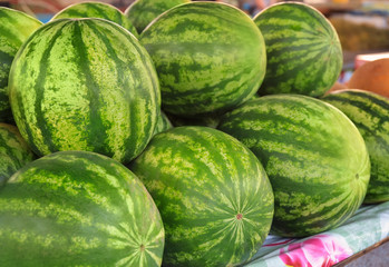 Fresh watermelons on counter at market
