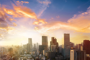 Obraz premium Cityscape of Tokyo city, japan. Aerial view of modern office building and downtown skyscraper of tokyo with clear sky background. Tokyo is metropolis and center of new asia's modern business