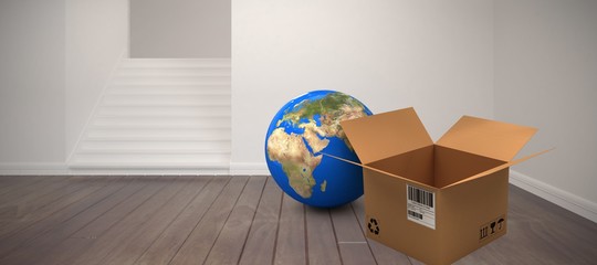 Composite image of planet earth and brown cardboard box