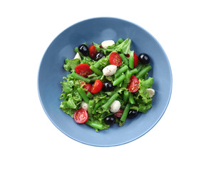 Plate of salad with green beans on white background