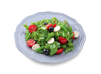Plate of salad with green beans on white background