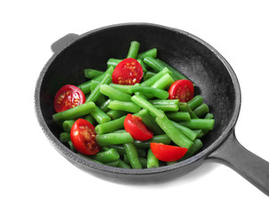Frying pan of salad with green beans on white background