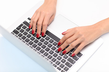 Fototapeta na wymiar Female hands are writing on the computer.