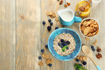 Nutritious oatmeal with berries on table