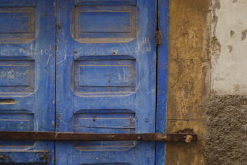 Wooden locked blue door in Morocco