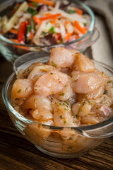 Raw chicken fillet breast cut into pieces.