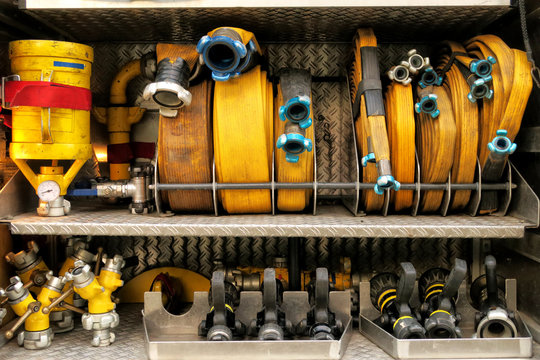 Fire hoses and connectors systematically arranged in fire engine