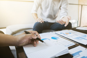 Business executives analyzing on valuation data paper