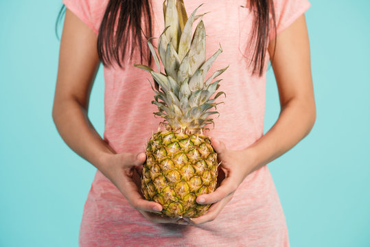  Girl holding pineapple