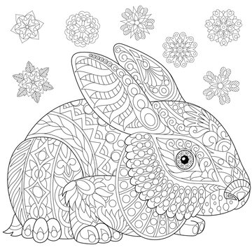 Coloring page of rabbit (bunny) and winter snowflakes. Freehand sketch drawing for adult antistress coloring book in zentangle style with doodle elements.