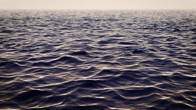Thrilling 3d rendering of a white and black shark swimming under the surface of the open ocean waves. It hides and can appear at any moment from the dark blue waves