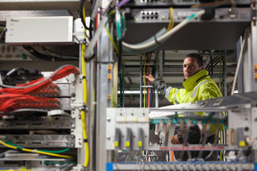 Working with optic fibre cables.