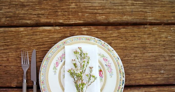 Various cutlery on wooden table 