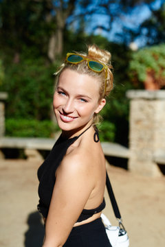 atractive blonde woman walking at the park